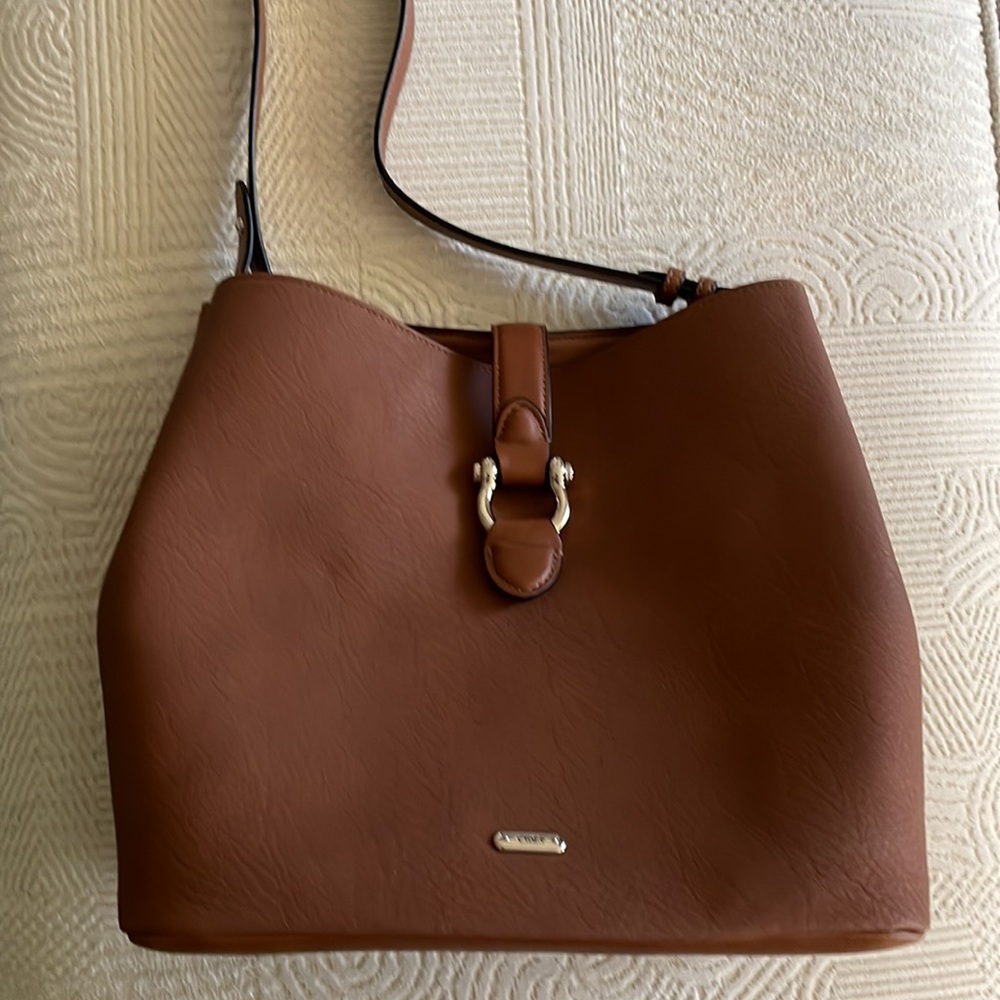 Chaps bucket bag with silver toned hardware.